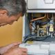 Technician checks and reparing the water boiler.